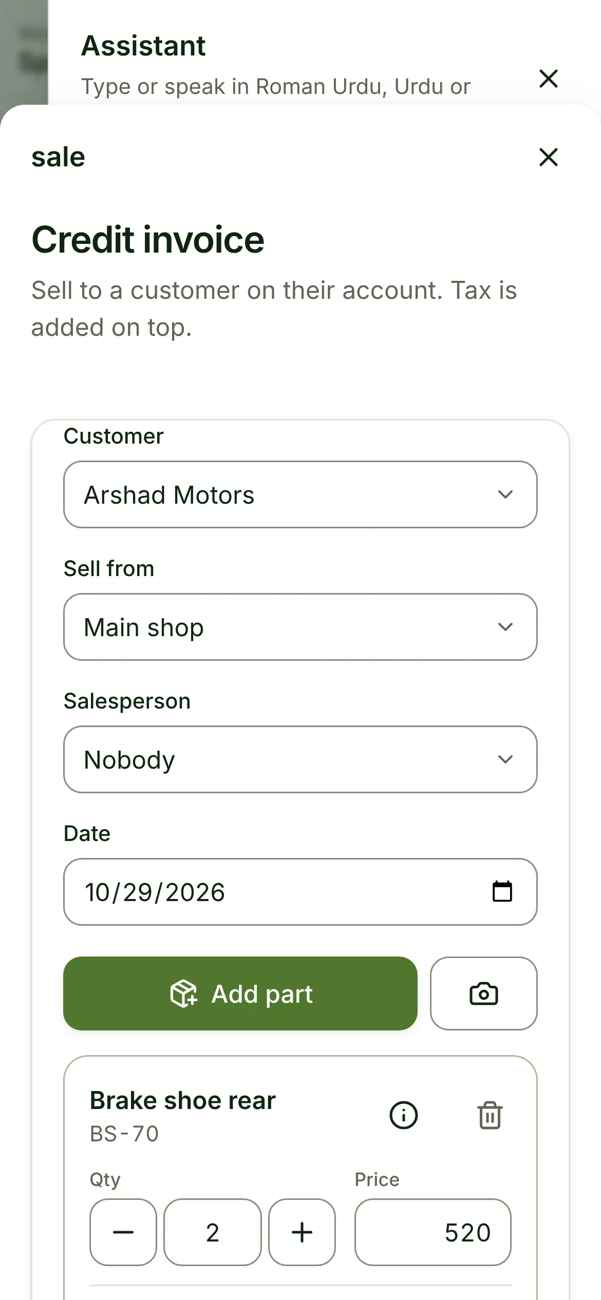The Sell screen opened by the assistant, prefilled with Arshad Motors and 2 brake shoes on credit