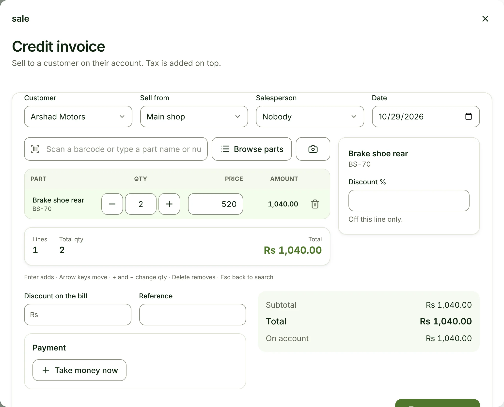 The Sell screen opened by the assistant, prefilled with Arshad Motors and 2 brake shoes on credit